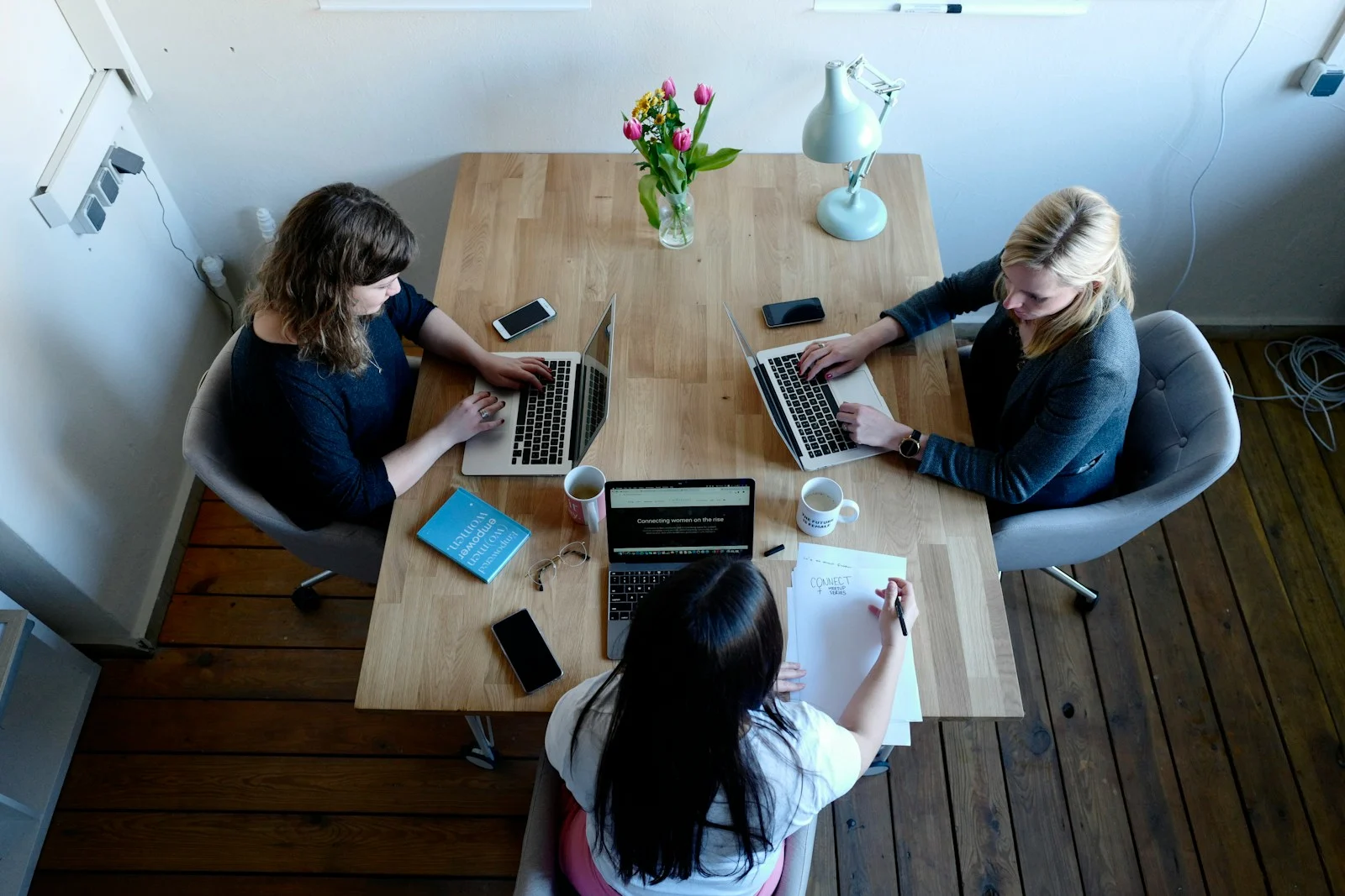 A small research team working together around laptops